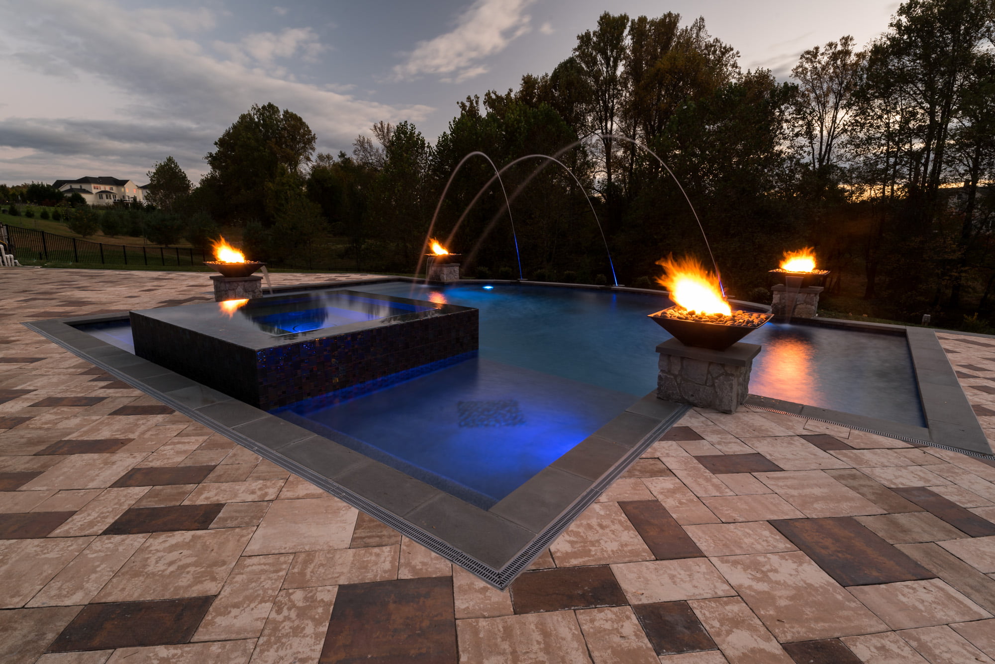 Custom angular pool with fire bowls and paver patio glenelg md